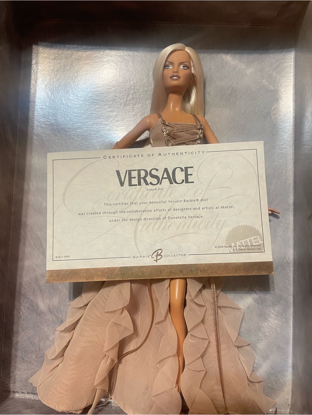CUTTING-EDGE HAUTE COUTURE INSPIRES VERSACE BARBIE® DOLL.
